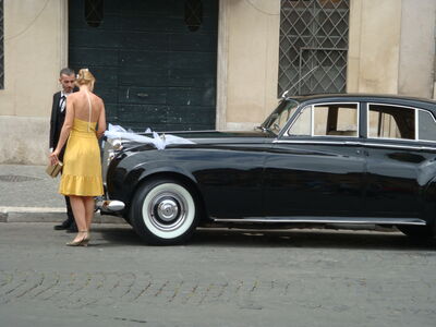 Keywords: car,auto,girl,wedding,lady,man,yellow dress,tuxedo,black,street