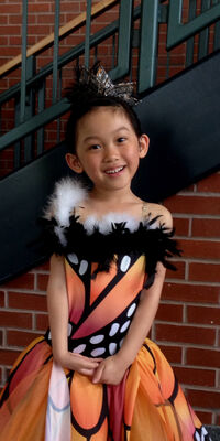 Keywords: lily,dancer,smiling,smile,hair up,orange and black costume,stairwell