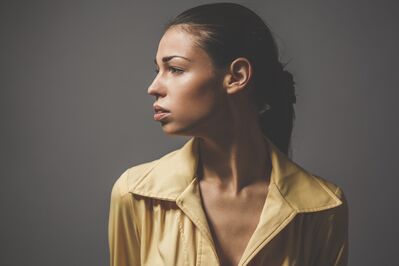 Keywords: woman,black wowan,yellow coat,profile