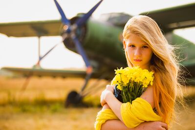 Keywords: aircraft,girl,white girl,long hair,yellow flowers,bouquet,airplane,single engine