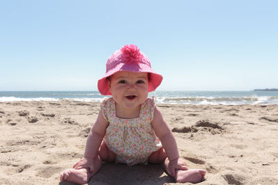 Keywords: baby,girl,beach,pink,hat,portrait of a baby on a beach