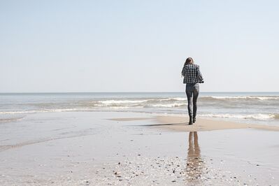 Keywords: woman,lady,beach,seashore,ocean,girl,plaid shirt,facing away,sand,waves,solitary