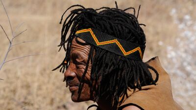 Keywords: botswana,man,braided hair,brown,headband,elder,wrinkles,dreadlocks,smiling,brown hood