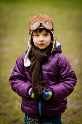 Keywords: portrait,child,kid,purple bomber jacket,goggles,pilot,cap,torso