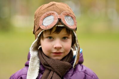 Keywords: portrait,child,kid,purple bomber jacket,goggles,pilot,cap