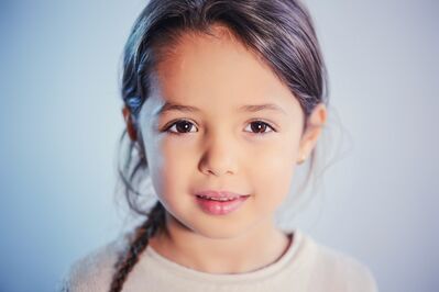 Keywords: girl,kid,child,braid,dark brown hair,white shirt,background