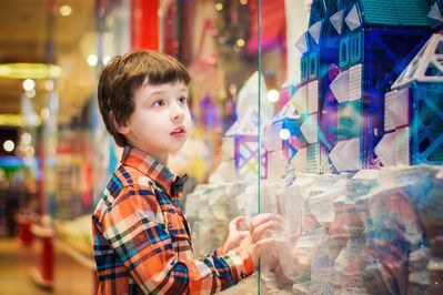 Keywords: boy,child,kid,plaid shirt,store window,looking bright lights,orange and blue