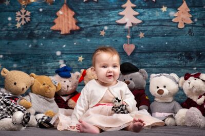 Keywords: baby,teddy bears,blue background,snowflakes,christmas trees,wooden,heart,white dress,bare feet