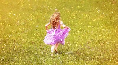 Keywords: portrait,girl running,pink,dress,leg in a cast,green field,child,long yellow hair,back view