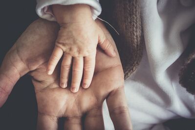 Keywords: hands,hand,baby hand,adult hand,white outfit