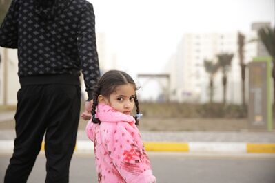 Keywords: girl,looking back,street,holding adult&#039;s hand,pick jacket,coat