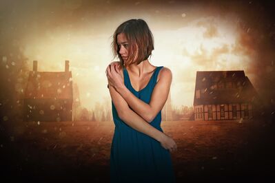 Keywords: girl,woman,youth,young,holding arms,blue-green dress,outdoors,buildings,houses