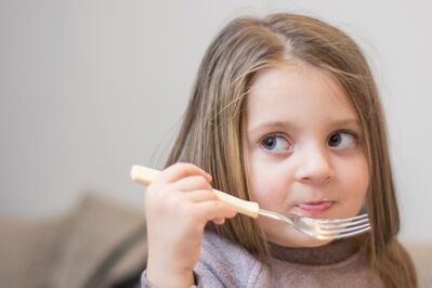 Keywords: portrait,girl,fork,eating,brown hair,looking right