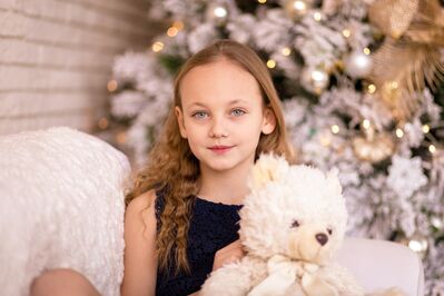 Keywords: girl,kid,child,white christmas tree,white teddy bear,blue dress,blonde hair