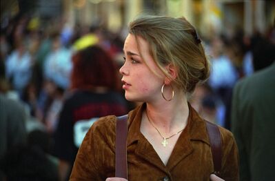 Keywords: girl,profile,brown dress,backpack,hoop earring,dark blonde,crowded street,scene