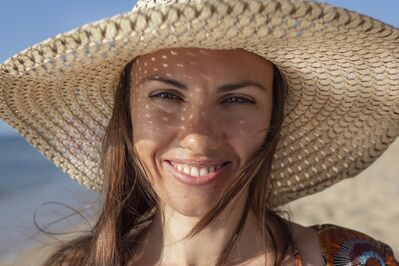 Keywords: girl,hat,summer,straw bonnet,face in shade,shadow,brown top,straight hair