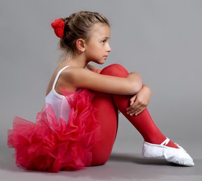 Keywords: girl,youth,young,ballet,tutu,tights,bow,red,white top,bare arms,profile,hair up,pointed toes