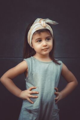 Keywords: portrait,girl,hair scarf,brown,hands,hips,grey top,t shirt,tshirt