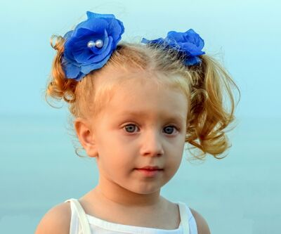 Keywords: girl,blue flowers,young girl with blue flowers in her hair