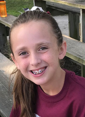 Keywords: girl,daughter,doug,over-all contrasts between light and shadow,smile,braces,purple top,better portrait painting