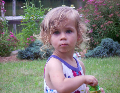   
Keywords: girl,outside,backyard,portrait of a flaxen-haired child,child,sundress