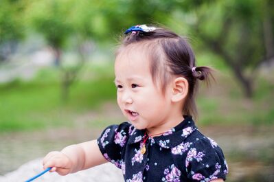 Keywords: portrait,girl,navy print dress,blue rope,hair pins,outdoors,talkingasian