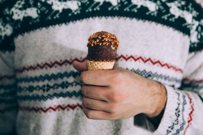 Keywords: ice cream,hand,sweater,child,chocolate,sprinkles,patterned,drawing a hand holding an object using charcoal