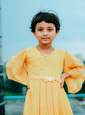 Keywords: girl,kid,child,short black hair,yellow dress,railing