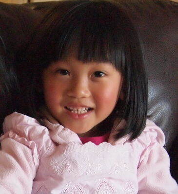 Keywords: portrait of a young girl in a pink jacket