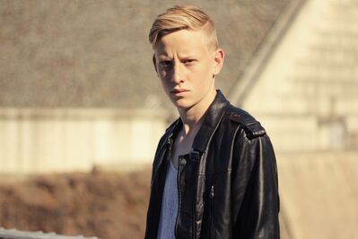 Keywords: young man,short hair,leather jacket