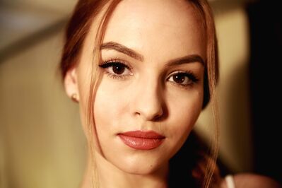 Keywords: woman,earring,portrait,hair across cheek