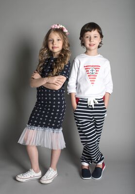 Keywords: portrait,child,kid,children,boy,girl,striped pants,black,white,patterned,flowers,blonde,brown,hands,pockets,headdress