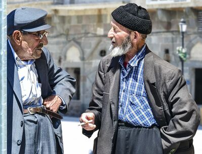 Keywords: oold men,talking,glasses,beard,mustache,middle eastern,caps,hats,jackets,high pants