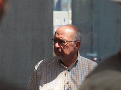 Keywords: old man,sun,a man outdoors in the sun,glasses,bright lsunlight