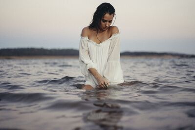 Keywords: beach,ocean,water,woman,white dress,dark brown hair,looking down