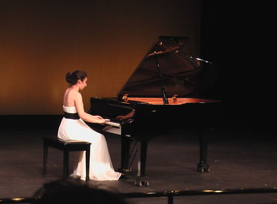 Keywords: piano,girl playing piano,woman,white dress,seated