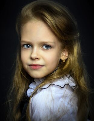 Keywords: girl,white blouse with black trim,long blonde hair,3/4 view,youth,young