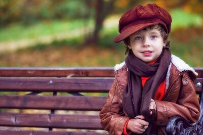 Keywords: reference_boy_park,a yong boy in a red hat