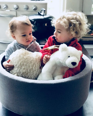 Keywords: two children,boy,girl,Max,a double portrait of two children and a white bear,toy,small bed