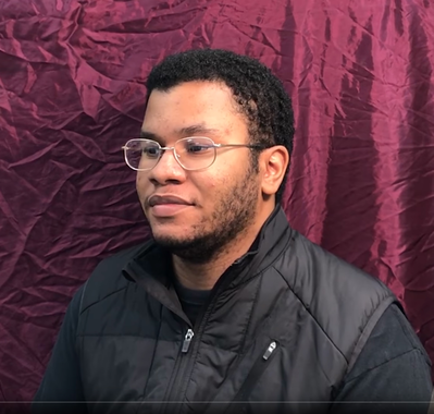 Keywords: three quarter view of a young man in glasses