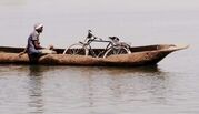 Shena_Kelly_Macdonald_crossing_the_river_on_boat.jpg