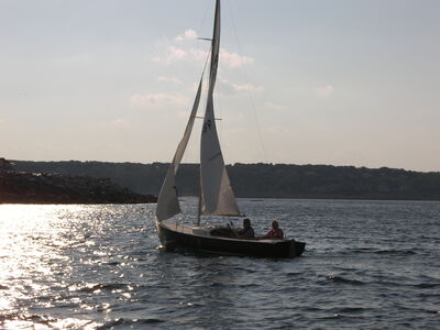 Keywords: painting a sailboat with an orange sail