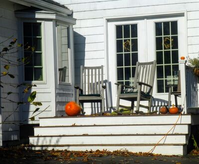 Keywords: house,rocking hairs,pumpkins,door,porch