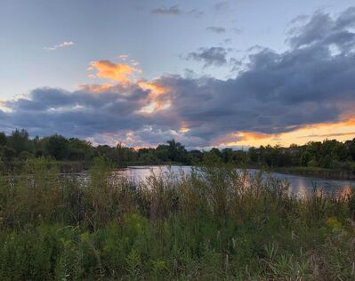 Keywords: sunrise,dark clouds,lake,water,greenry,trees