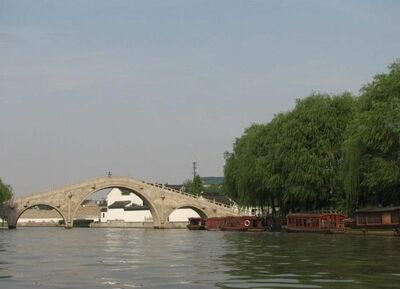 Keywords: bridge,trees,reflection,water,buildings,sky