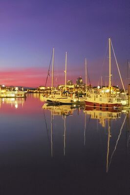 Keywords: yellow,reflection,boats,harbor,pink,blue,sky