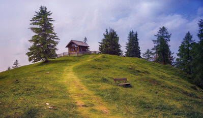 Keywords: house,hill,bench,trees