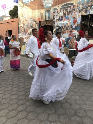 Keywords: dancers,white,festival,street,mural on wall,grey tile