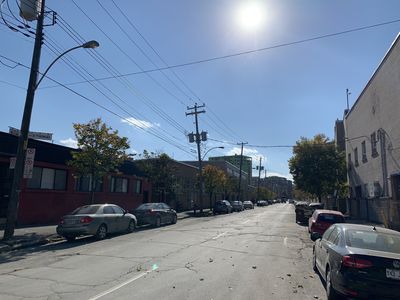 Keywords: street scene,cars,bright sky,blue