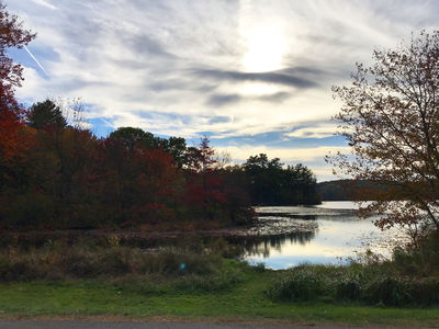 Keywords: red leaves,water,river,lake,clouds,shadows,reflections